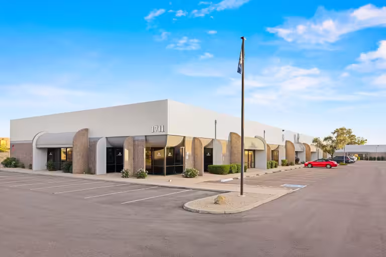 Building 1711 at Deer Valley Industrial Campus beside its parking lot.